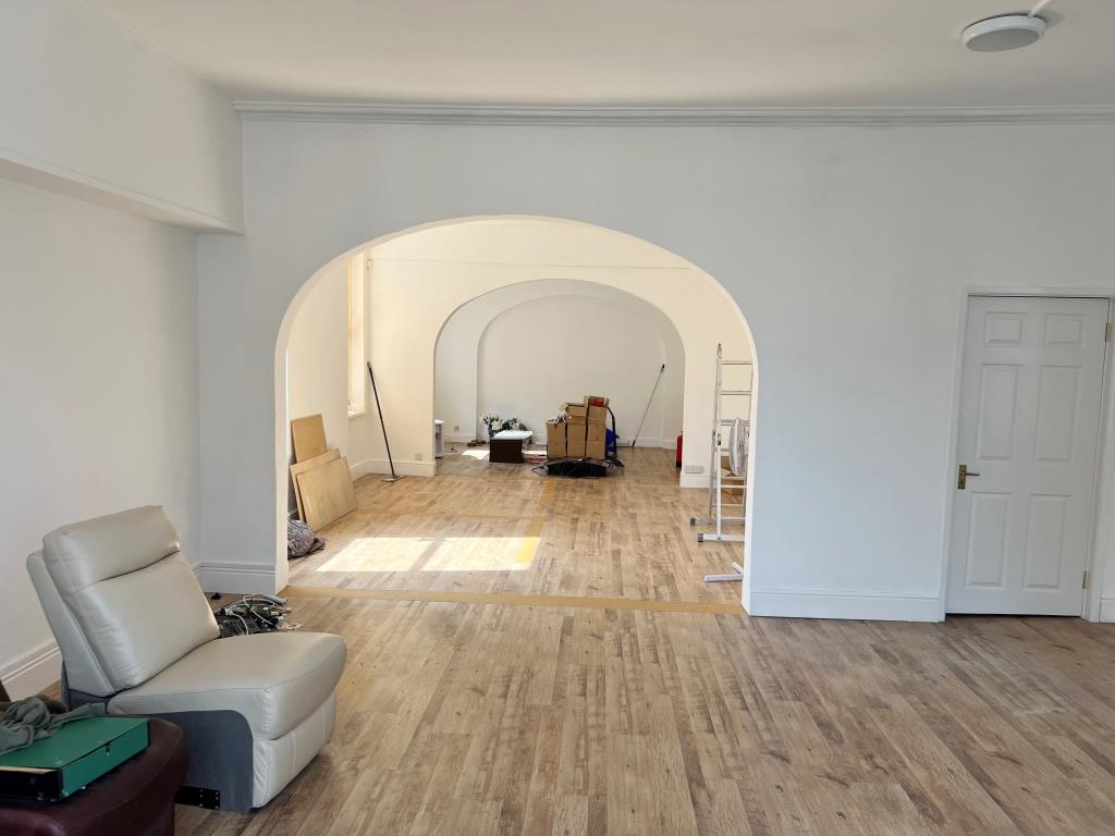 Lot: 135 - COMMERCIAL PROPERTY IN HIGH STREET LOCATION - Internal view with white painted walls and wood effect flooring